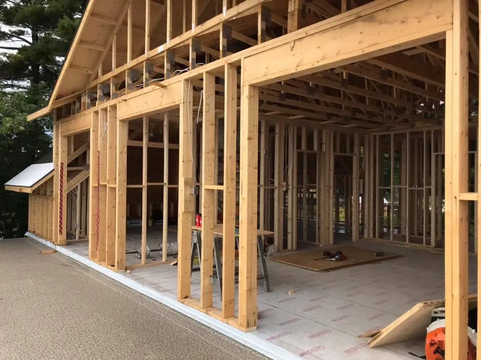 Framed lake house interior during electrical rough-in.