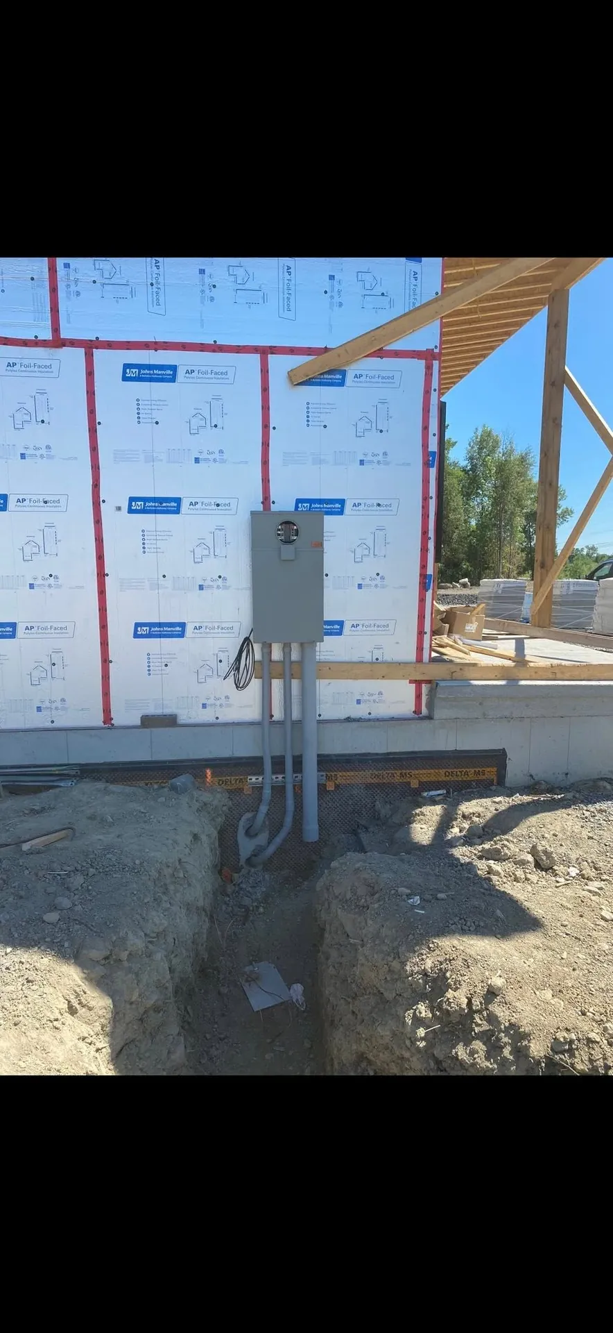 Exterior electrical service equipment installed on a new commercial building.